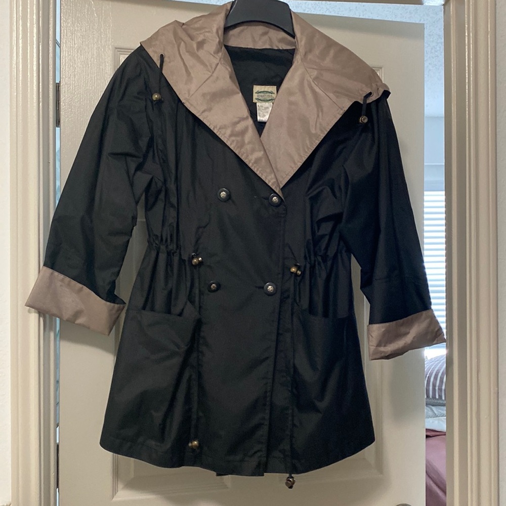 Hooded water resistant rain jacket.